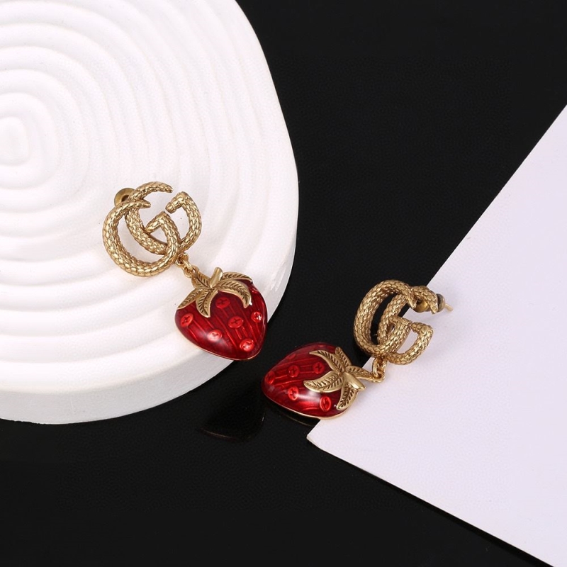 G*u*i earrings